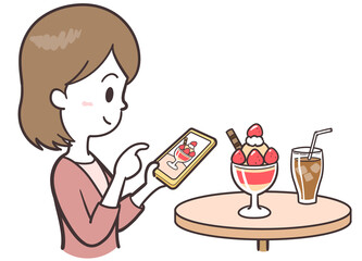 SNSに写真をアップする女性