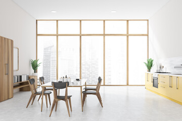 White kitchen with yellow countertops and table