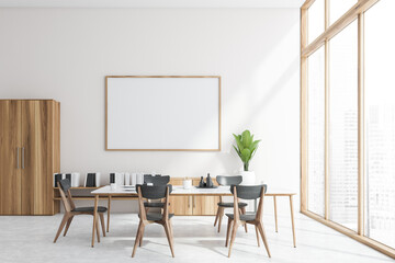 White dining room interior, bookshelf and poster