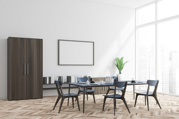 White and wood dining room corner shelf and poster