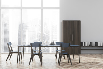 Panoramic white dining room with wooden bookshelf