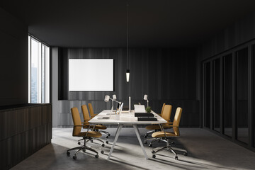 Dark wooden open space office with poster