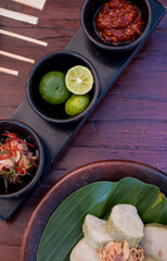 Traditional Indonesian food- Lontong. Compacted, cooked wrapped rice in banana leaves.