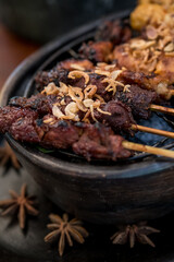 Meat skewers in a herb marinade on a grill pan. Meat kebab