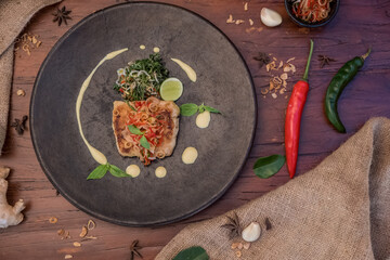 Grilled spicy fish fillet steak. Indonesian food. Delicious healthy eating.