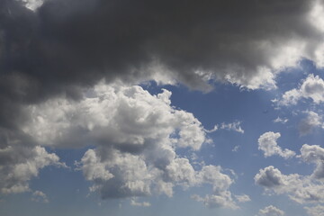 white fluffy clouds in the blue sky.