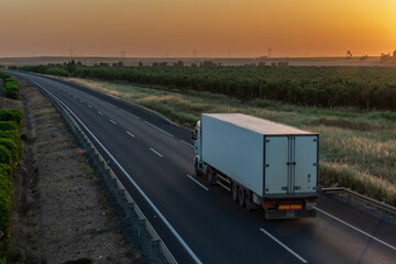 Truck with refrigerated semi-trailer to transport perishable products on the highway