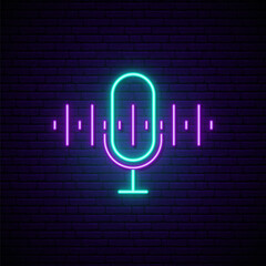 Podcast Neon sign. Bright neon mic icon on dark brick wall background. Vector design template. © greens87