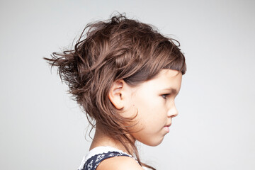 Portrait of a child with a short trendy hairstyle - 354014132