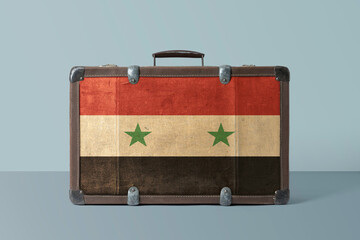 Syria flag on old vintage leather suitcase with national concept. Retro brown luggage with copy...