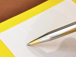 One person is writing on paper.