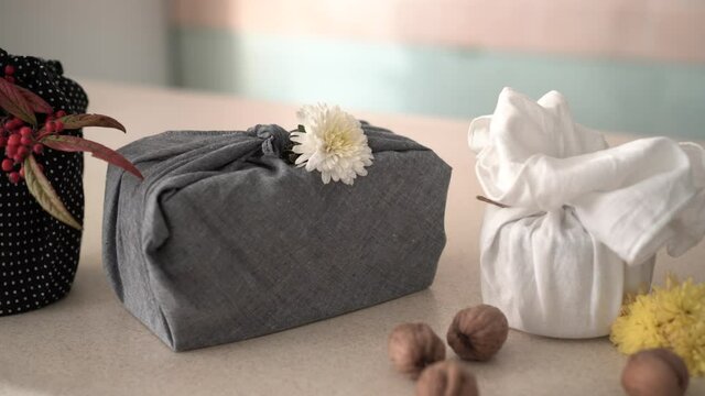 Wrapping gifts with fabric. Organic natural fibers like hemp, burlap and cotton cloth. For decorating - dried compostable flowers. Zero waste lifestyle