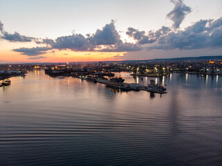 Obraz premium Drone View of the Sea and the Varna Sea Port at sunset time with dramatic sky