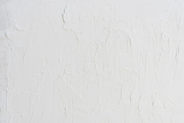 White texture painted with irregular brush strokes. Minimal rustic wall background