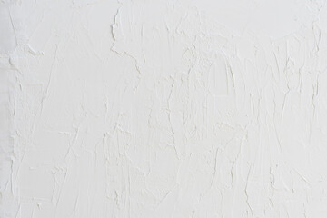 White texture painted with irregular brush strokes. Minimal rustic wall background