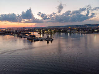 Obraz premium Drone View of the Sea and the Varna Sea Port at sunset time with dramatic sky
