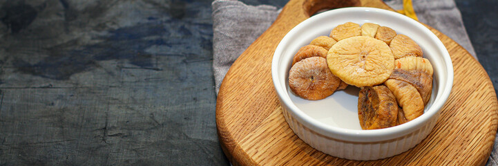 dried figs fruits natural sweet dessert Menu concept serving size. food background top view copy space for text keto or paleo diet organic healthy eating