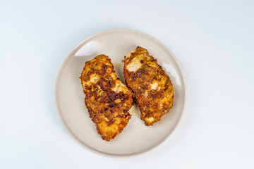 Burnt Grill Fried Chicken Breast Fillets on White Plae Isolated.