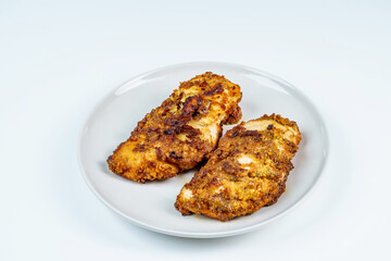 Burnt Grill Fried Chicken Breast Fillets on White Plae Isolated.