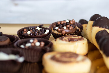 The morning at home begins with a sweet breakfast. Baked biscuits with chocolate and pralines and horseshoes served on a tray.