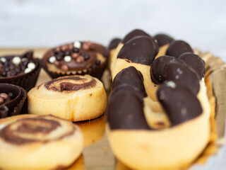 The morning at home begins with a sweet breakfast. Baked biscuits with chocolate and pralines and horseshoes served on a tray.