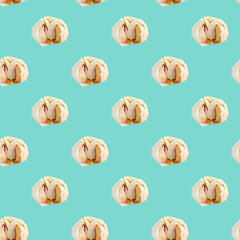 Seamless pattern with garlic on a blue background. Minimal isometric texture of food. Use for boards, print on fabric.