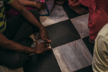 people pray or meditate on the floor in asia