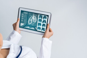 Close of female doctor hands working with tablet pc computer