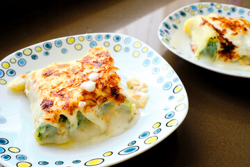 Typical Italian cannelloni with ricotta and spinach just removed from the oven.