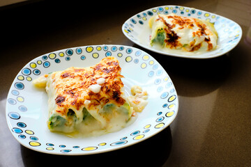 Typical Italian cannelloni with ricotta and spinach just removed from the oven.