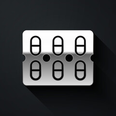 Silver Pills in blister pack icon isolated on black background. Medical drug package for tablet, vitamin, antibiotic, aspirin. Long shadow style. Vector Illustration.