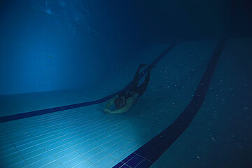 freediving training in the pool, in fins underwater view