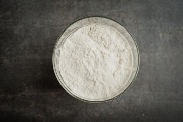Wheat flour in a glass jar on the kitchen top