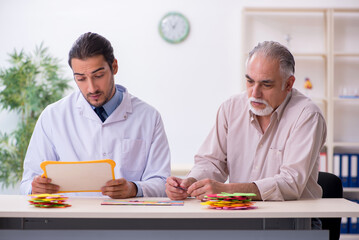 Doctor and patient suffering from Alzheimer disease