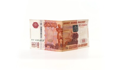 5000 rubles banknote rotates on a white background. Isolate. Half-folded money side view. The money depicts the Monument to Muravyov-Amursky with the coat of arms of Khabarovs and Bridge over the Amur