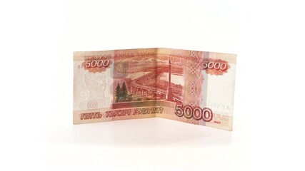 5000 rubles banknote rotates on a white background. Isolate. Half-folded money side view. The money depicts the Monument to Muravyov-Amursky with the coat of arms of Khabarovs and Bridge over the Amur
