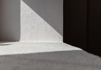  the rays of the sun unusually and beautifully fall on the wall, the shadows are clear and graphic. abstract airtight shadow on the wall and windowsill. High quality photo
