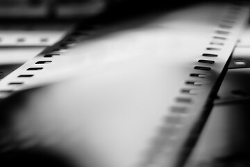 Black and white negative film with reflecteions in blur. 35mm negative film. Photographic film view...