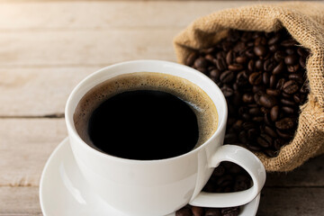 Close up black coffee in a coffee cup  isolated on wood background. with clipping path.