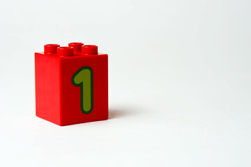the number one written on the block from the children's constructor