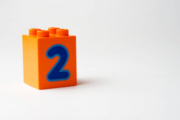 the number two written on the block from the children's constructor