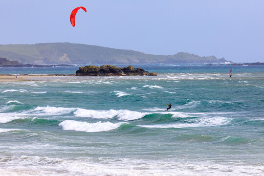 Lone Kite Surfer sailing across Mounts Bay  Marazion and photographed from the public road