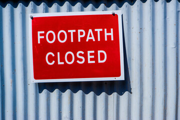 footpath closed red warning sign in Kendal