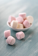 Closeup of pink and white marshmallows with a shallow depth of field
