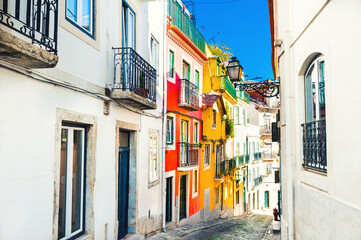 Cozy street with old architecture in Lisbon, Portugal. Famous travel destination