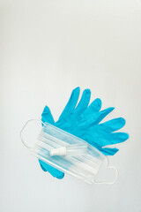 Coronavirus prevention medical surgical mask, blue gloves and hand sanitizer gel for hand hygiene corona virus protection.