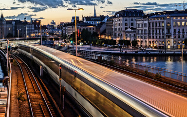 Fototapeta na wymiar fast railway in Stockholm city at dusk