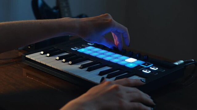 Girl Playing At Home Studio With Digital Midi Keyboard And Audio Interface