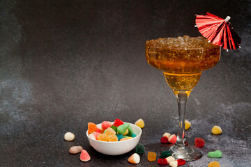 Iced tea cocktail glass and   jelly beans bowl