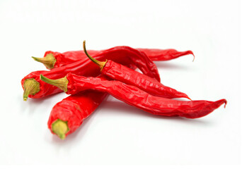 red dried peppers on white background